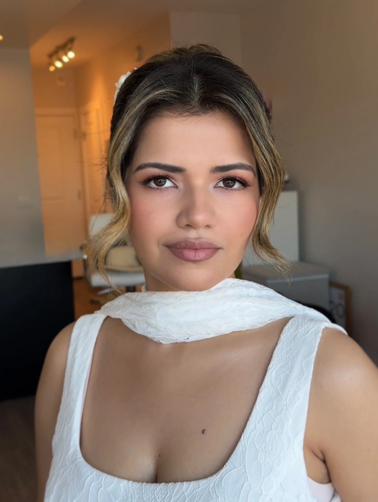 Soft bridal makeup with rosy lips and gently defined eyes
