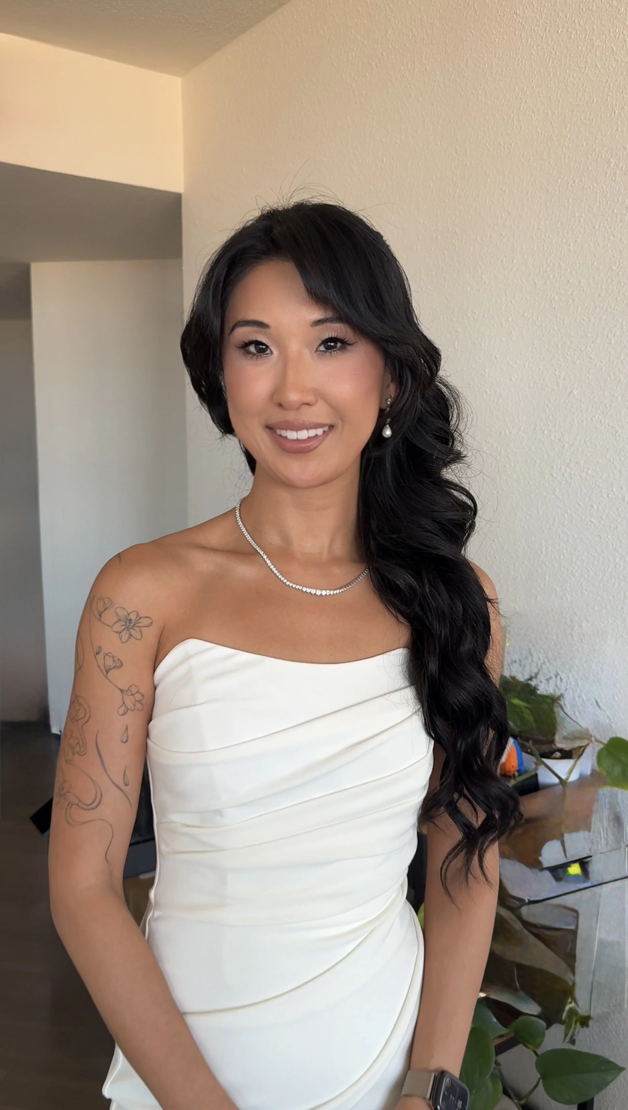 Bride in a strapless gown with long polished Hollywood waves