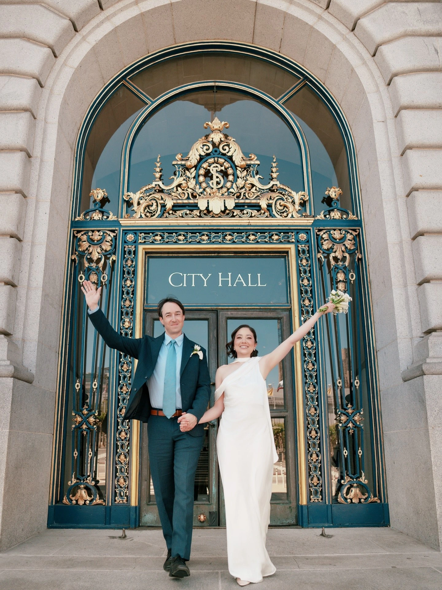 Newlyweds celebrating outside City Hall